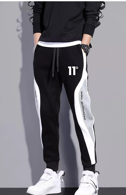 11 pantalones de chándal estampados para hombre, pantalones para correr de retales, traje masculino, pantalones sueltos, pantalones rectos, nueva ropa de moda para primavera y otoño