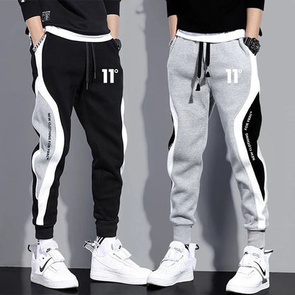 11 pantalones de chándal estampados para hombre, pantalones para correr de retales, traje masculino, pantalones sueltos, pantalones rectos, nueva ropa de moda para primavera y otoño